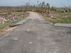 Pavement scoured off the surface along Brown St in Phil Campbell. 