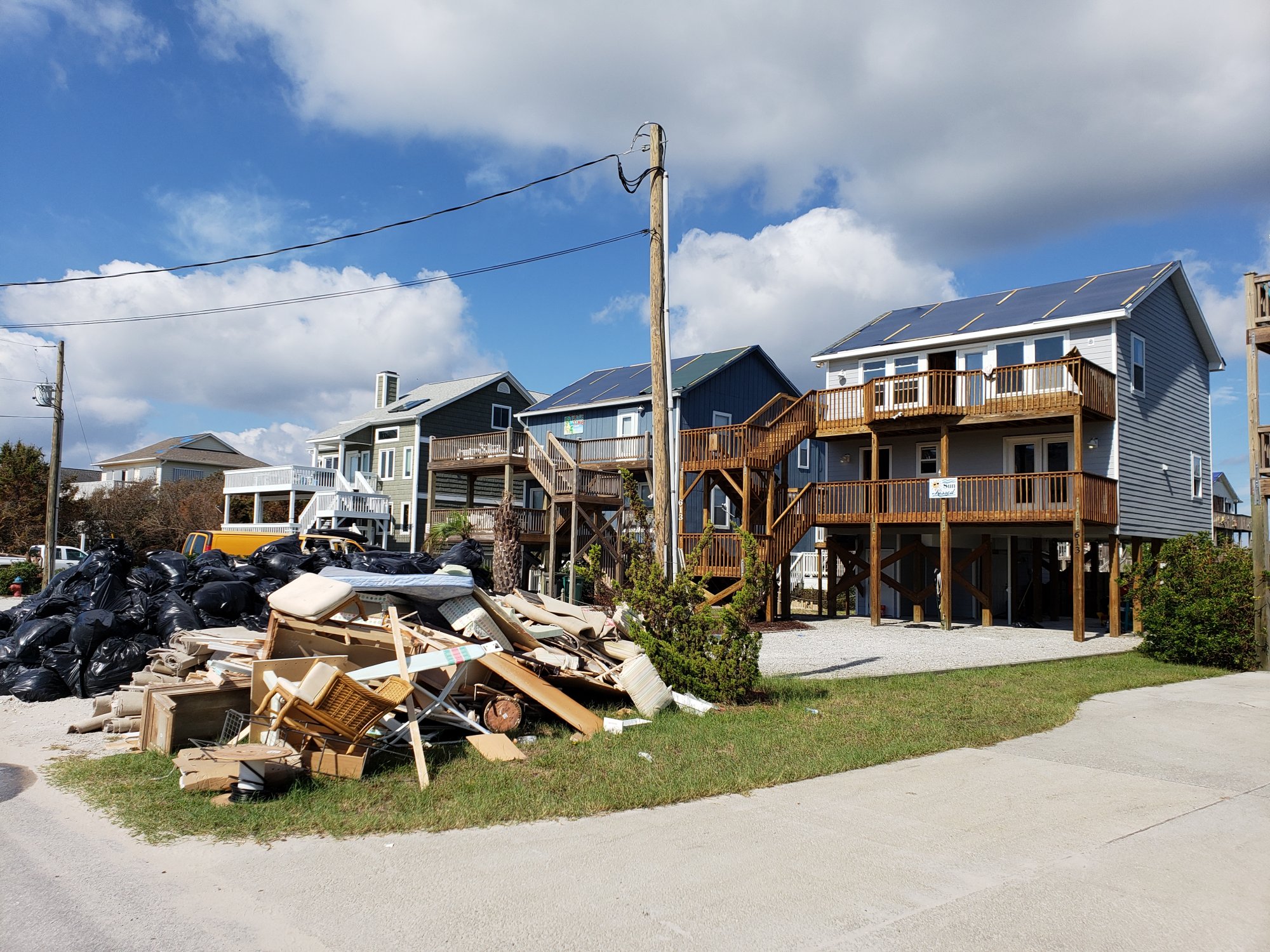 Many homes suffered roof damage, allowing the 15 to 25 inches of rain that fell to destroy the homes' interiors.  Piles of molded and water damaged items were a common sight for weeks after the storm. (Photo credit: Carl Morgan/NWS)