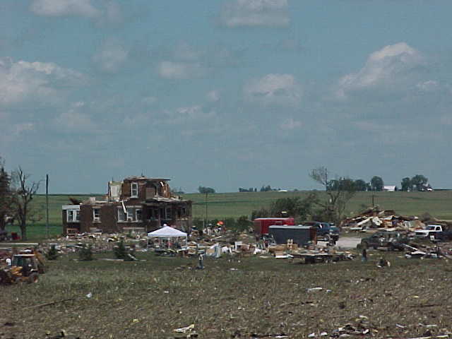 Looking northwest from the hill east of the Parsons plant, a severely damaged farmstead is seen in the distance.