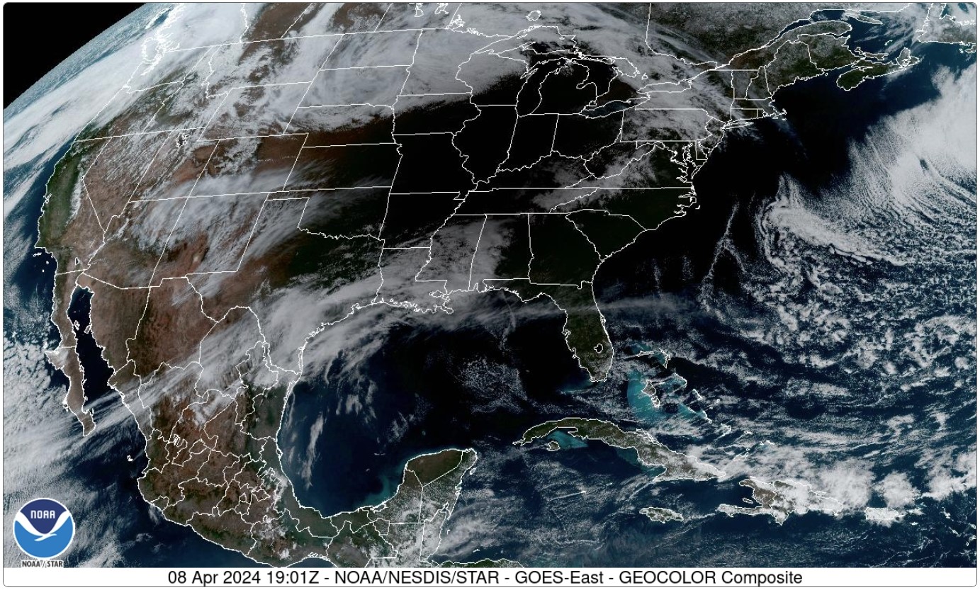 Visible satellite image from 2:01 pm CDT, showing much of the light over the Midwest being blocked by the moving shadow