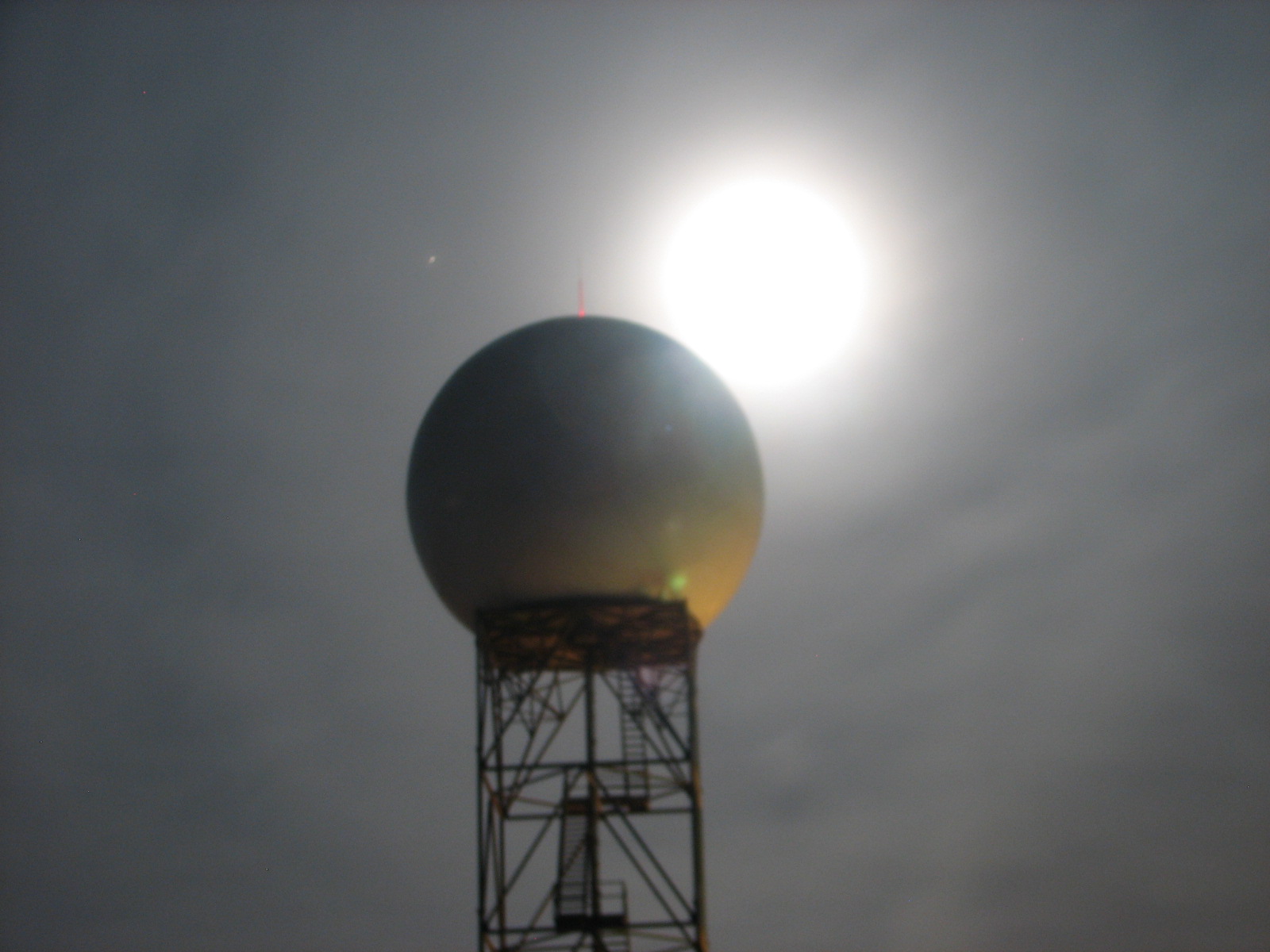 Close up picture of KIWX WSR-88D radar with Wolf Moon in background on right and planet Mars just to left of radome.