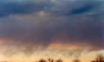 This is a great example of scud clouds. These clouds hang below the base of clouds and are often erroneously reported as funnel clouds. This picture taken by Sam Lashley in Millersburg, Indiana, in Elkhart County.