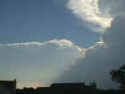 Towering cumulus and the edge of a cumulonimbus cloud. In the upper right corner you can see the edge of the updraft tower and the anvil as it begins to spread out.  Picture taken by Loretta Barlow on May 9, 2000, in northwest Allen County in Indiana...approximately 4 miles southwest of Huntertown.