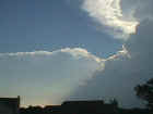 Towering cumulus and the edge of a cumulonimbus cloud. In the upper right corner you can see the edge of the updraft tower and the anvil as it begins to spread out. Picture taken by Loretta Barlow on May 9, 2000, in northwest Allen County in Indiana...approximately 4 miles southwest of Huntertown.