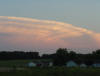 This photo was taken by Eric Flory on June 1, 2002, from Peru, Indiana. It is a picture of the top portion (the "anvil") of a very large thunderstorm near Terre Haute. The storm produced large hail in the Dana (Vermillion County) and Brazil (Clay County) areas, and created 58 m.p.h. winds at Spencer (Owen County). The center of the storm was 100 miles away from the photographer when this picture was taken.