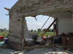 A close-up of the garage of the above tornado-damaged house, June 11, 1998.