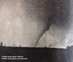 Here's the same LaPaz tornado, at about the same time, but viewing it from the opposite direction. With the bright sky now behind the tornado, the funnel appears dark.
