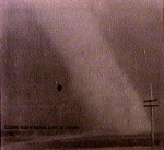 Tornado at LaPaz, Indiana, at 6:00 p.m. April 11, 1965. With dark clouds to the east and bright sky behind the photographer, the funnel appears very light in color. Photo by Indiana State Trooper Nick Chandler.