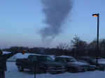 An experiment you can try at home! This was sunrise on December 23, 2000, at the weather office. The temperature was almost 10 degrees below zero. We are throwing hot water into the air and watching it freeze into a solid. Picture taken by Todd Holsten, meteorologist.