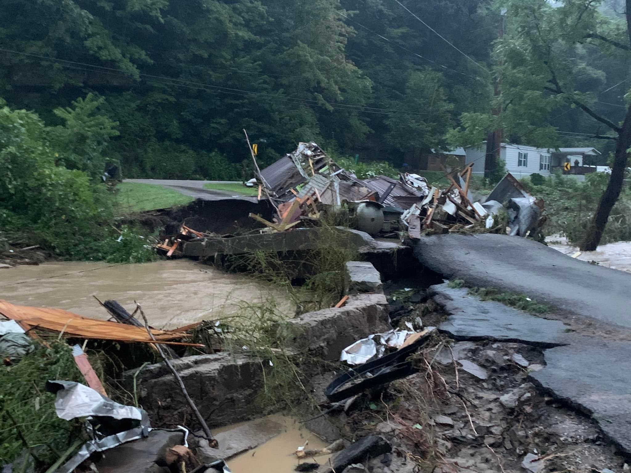 Destroyed roads and structures due to flash flooding in Chavies, KY
