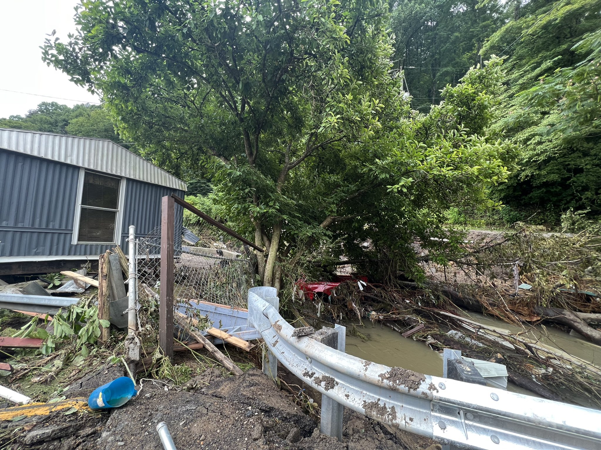 A house was damaged by flash flooding in Bulan, KY
