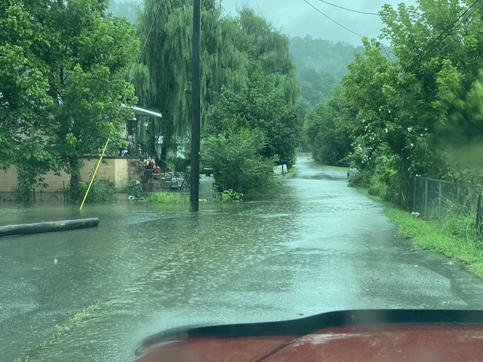 Water flowing over a road in Emma, KY