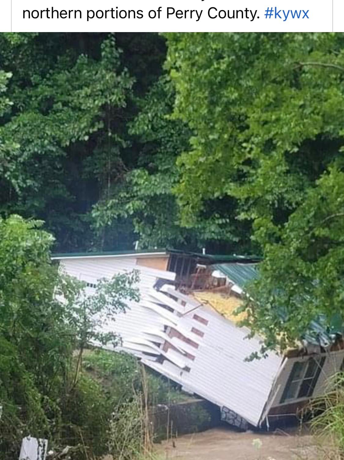 A house in Chavies, KY slid off its foundation and broke in half on the side of a bluff