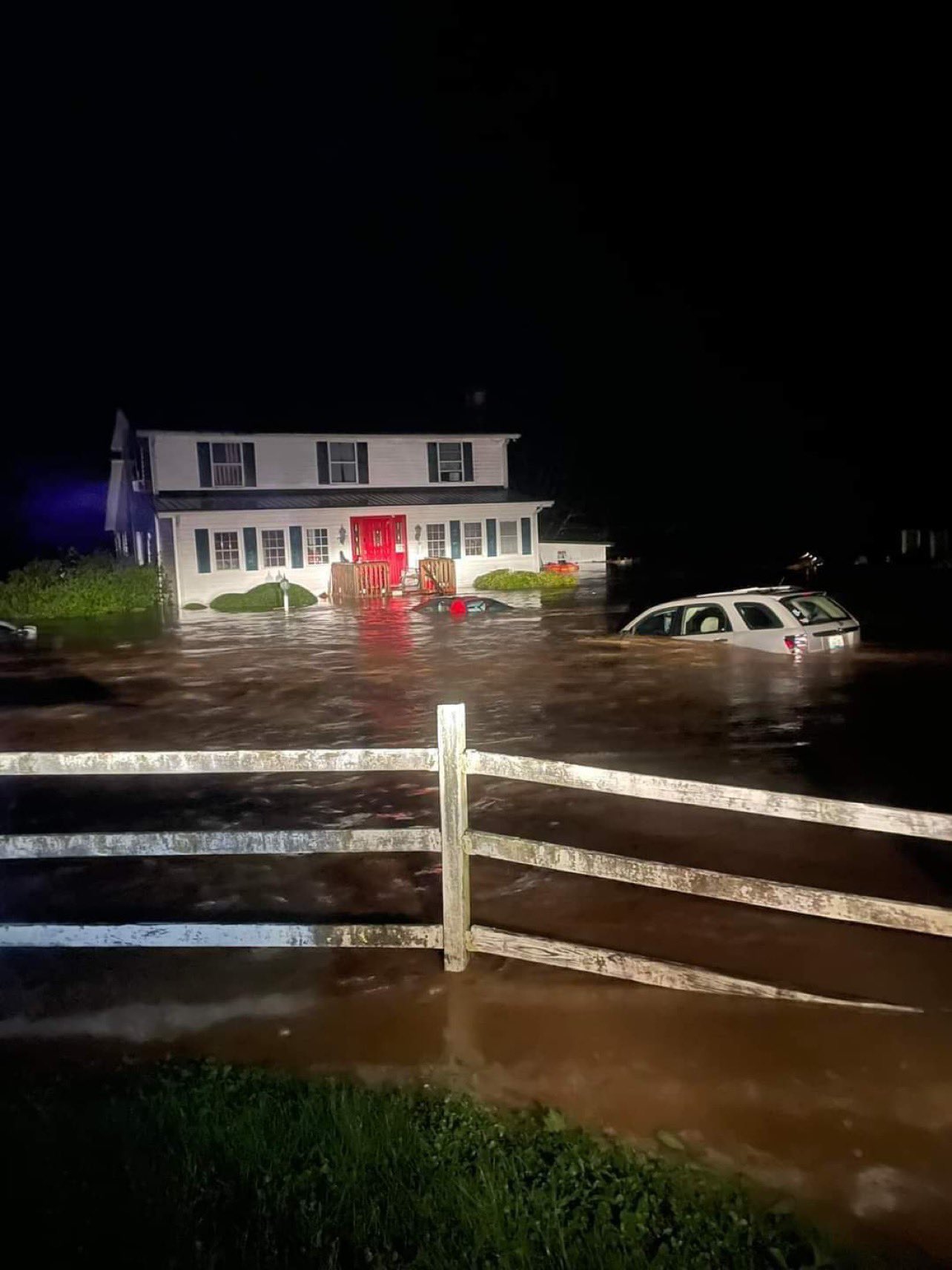 House and property inundated with water due to flash flooding in Emmalena, KY