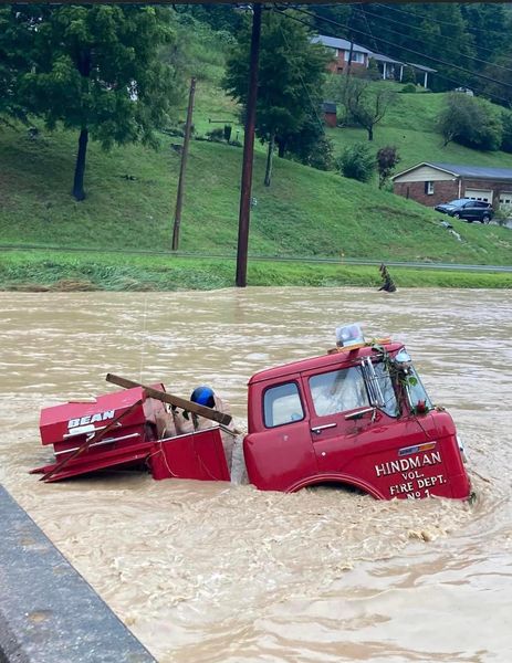 A fire engine submerged in flood waters in Hindman, KY in Knott County