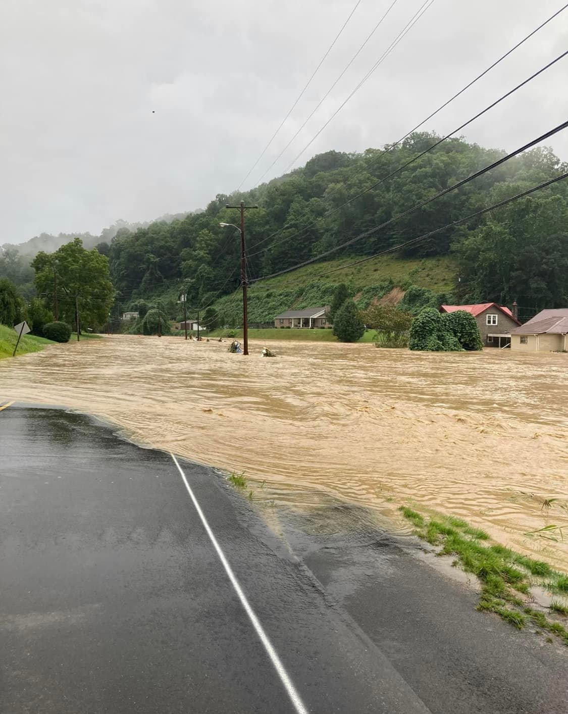 Flood waters over roads and surrounding houses in Hindman, KY