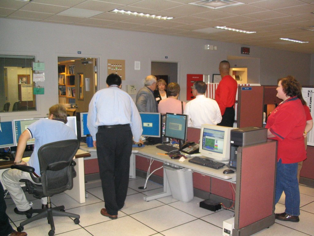 Guests gathering in the operations area before the presentations
