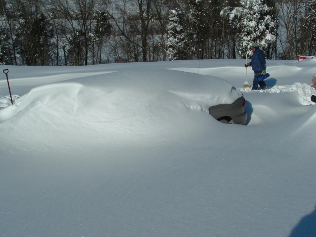 A car buried in the snow in Milltown, Indiana on December 22, 2004