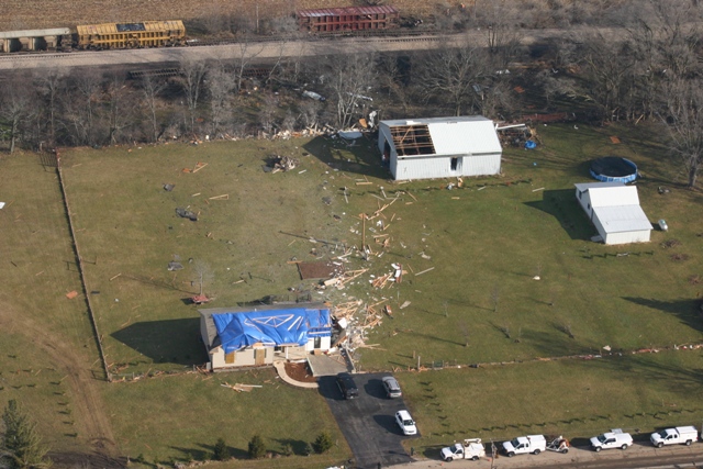 photo showing damage from the Poplar Grove Harvard tornado