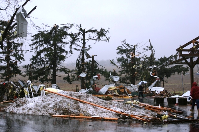 Photo showing tornado debris on snow covered ground