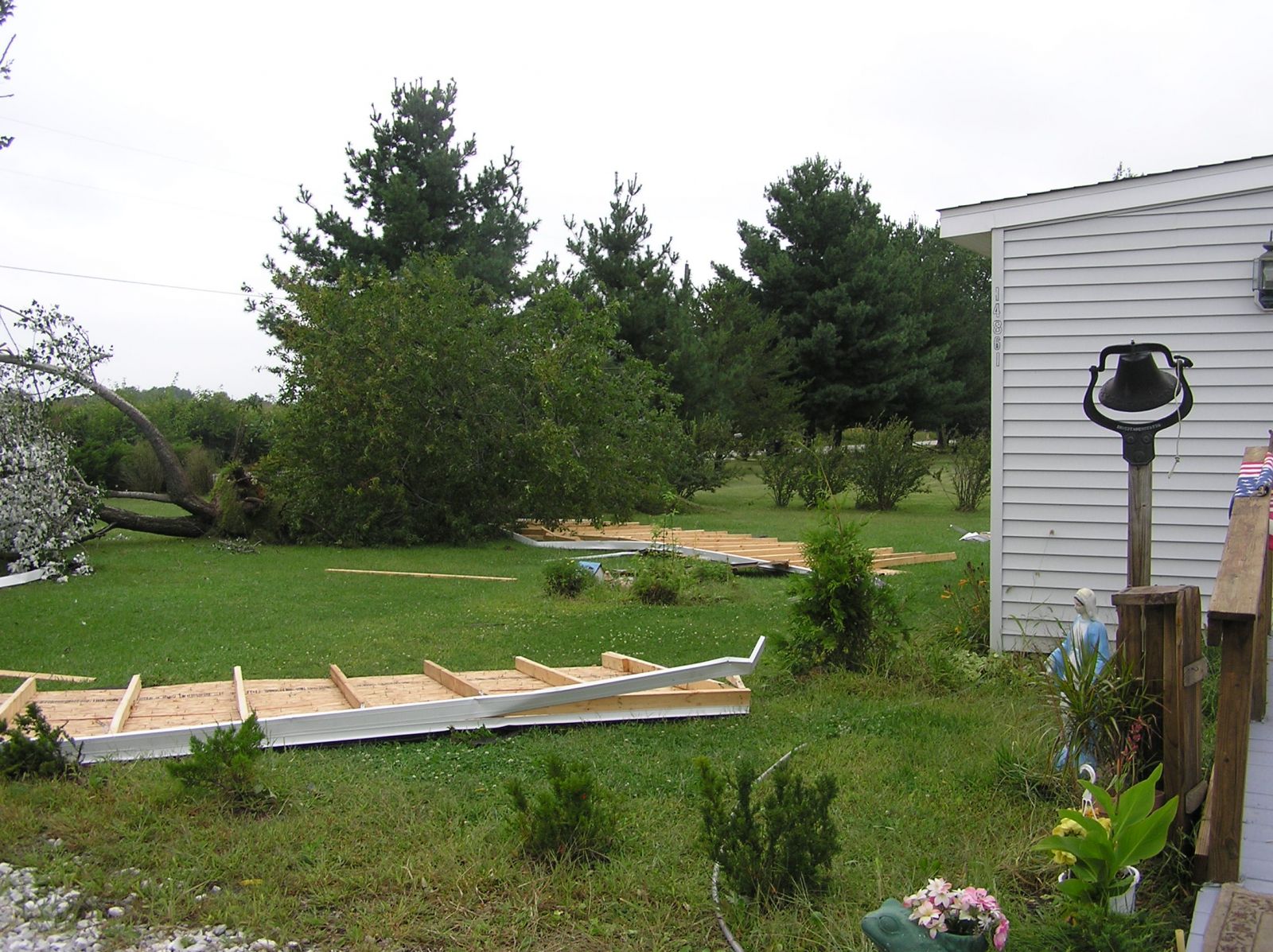 Residence where two trees were uprooted and roof blown off of mobile home
