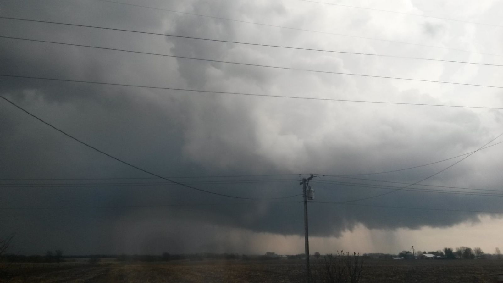Photo showing a low cloud base and an area of rotation prior to tornado development