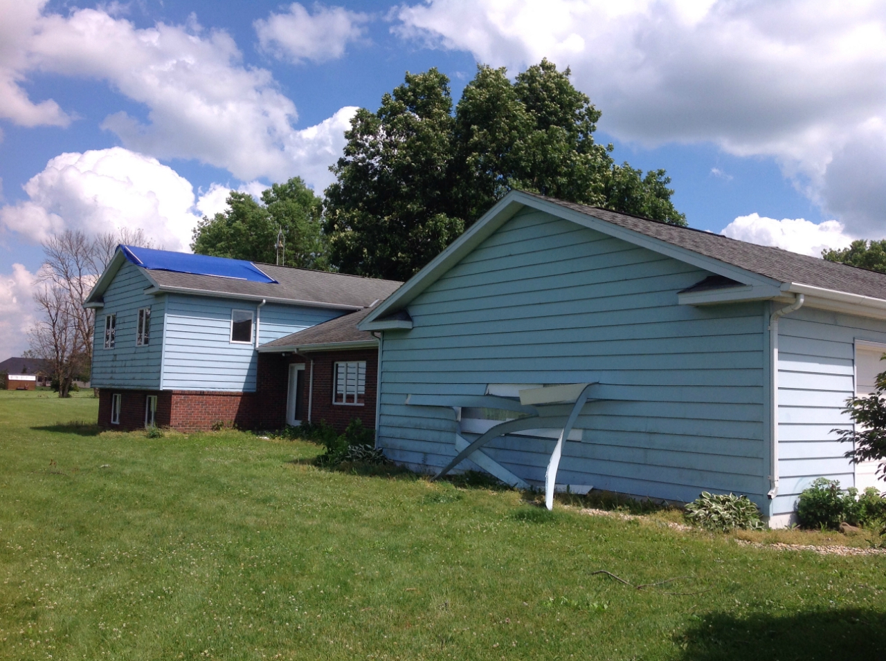 Photo showing damage to house from Earlville tornado