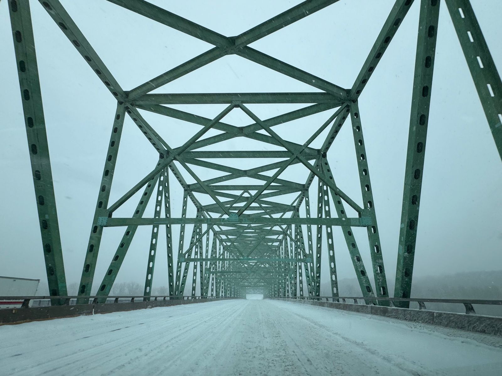 Photo of a snow-covered I-64/US 40 crossing the Daniel Boone Bridge over the Missouri River.