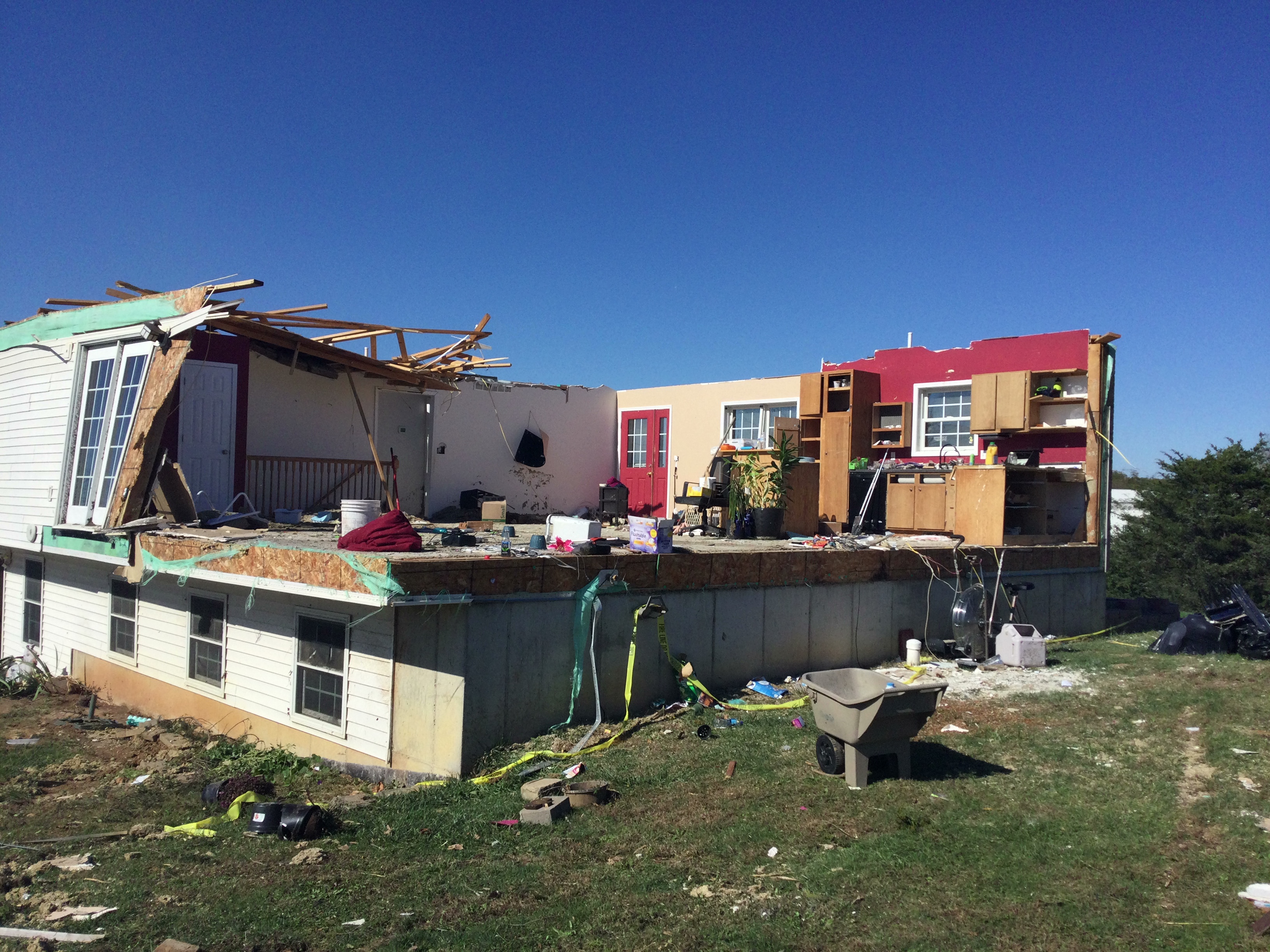 Photo of home that lost it's roof and a couple of side walls from a tornado in Coffman, MO.