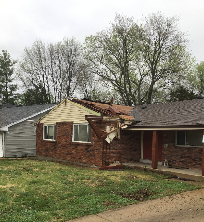 Photo of home with damaged roof