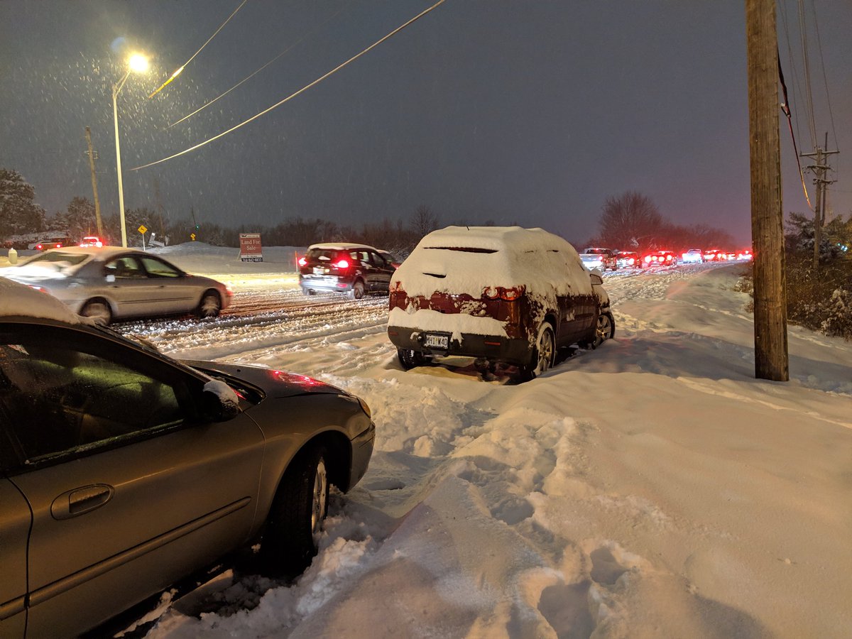 Another photo of slow traffic due to snow covering Tesson Ferry Road about two miles south of St. Anthony's Hospital. Also, shows abandoned vehicles from earlier accidents.