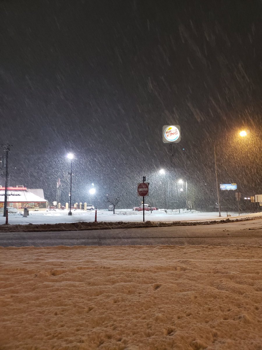 Photo of snow falling and covering roads near the intersection of I-55 and Pevely, MO.