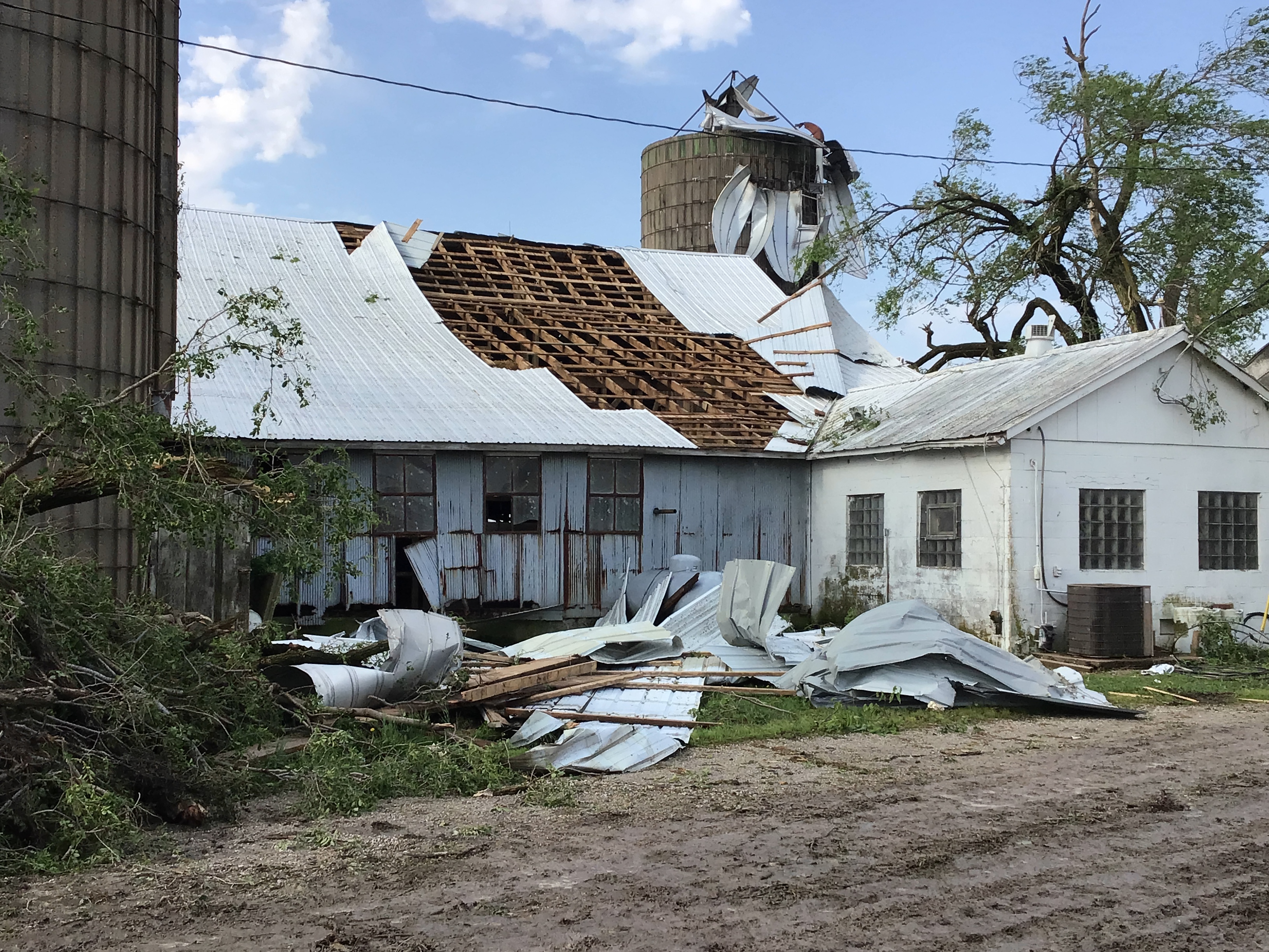 Part of a metal roof was torn off by the tornado, and a grain silo was also damaged.