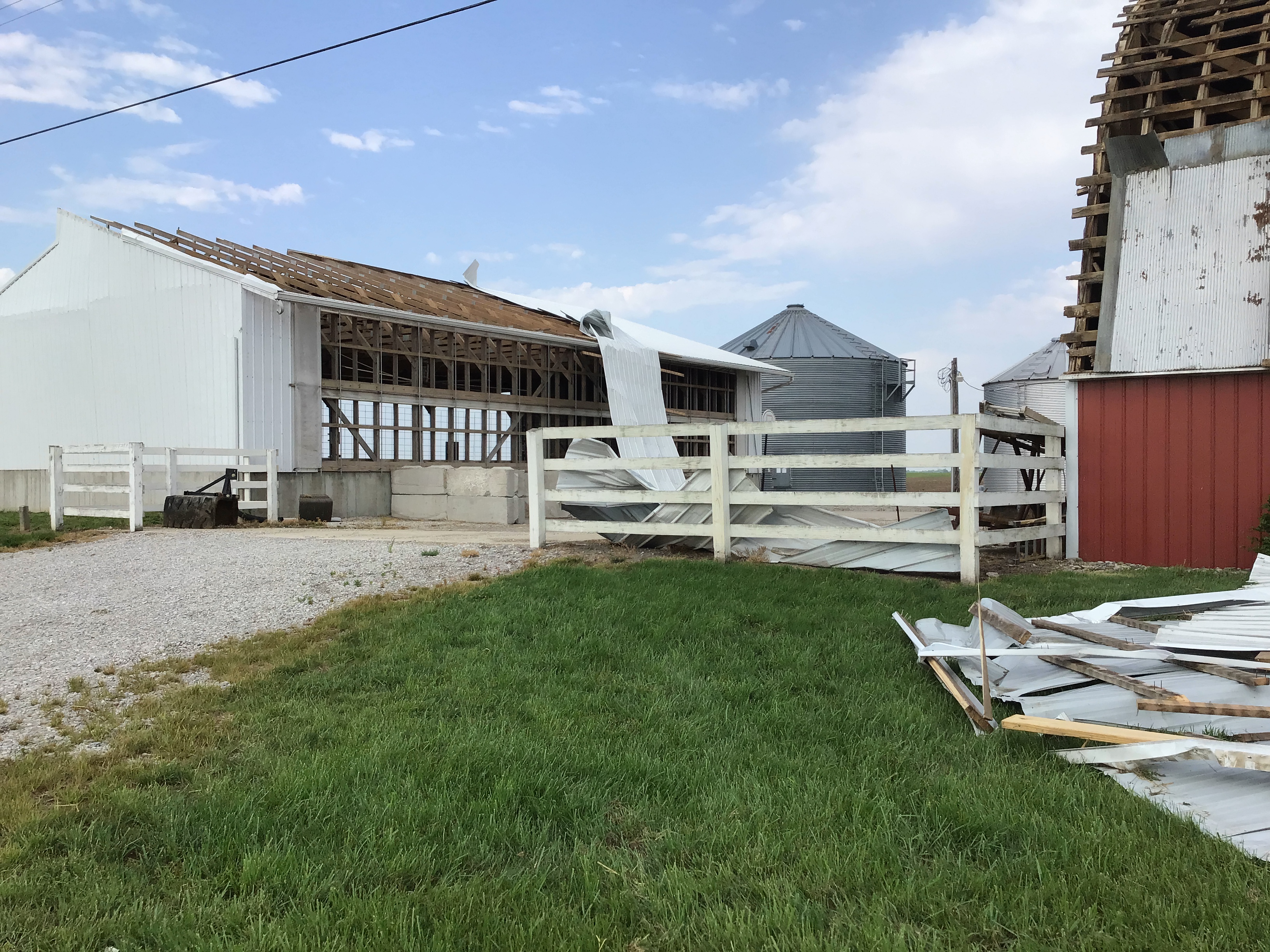 The metal roofs of several outbuildings were largely torn off by the tornado.