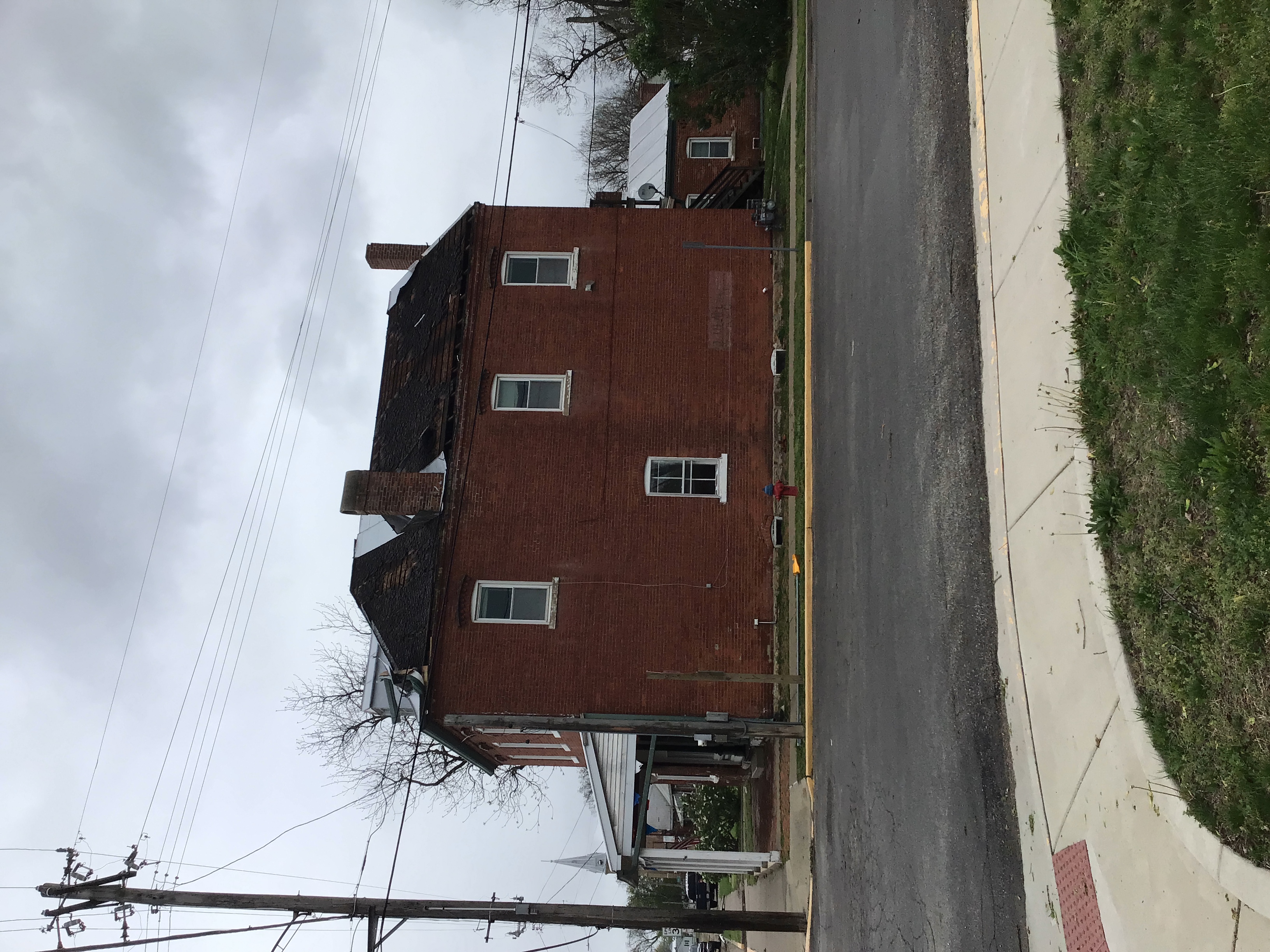 Photo of damage to the roof of a house in Hecker, IL.