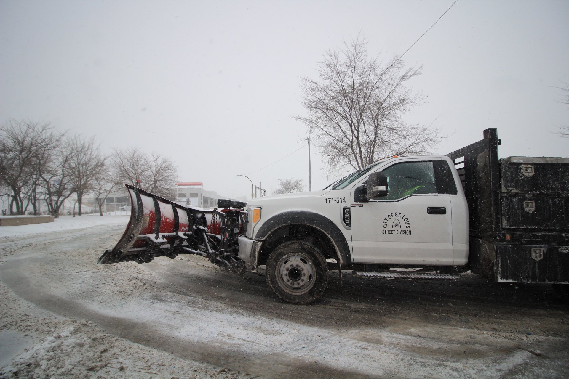Snow plow working on the streets of St. Louis, MO.