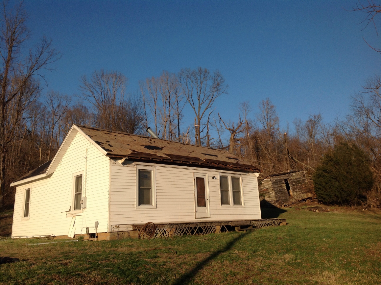 Photo of damage to a house on Illinois Route 3.