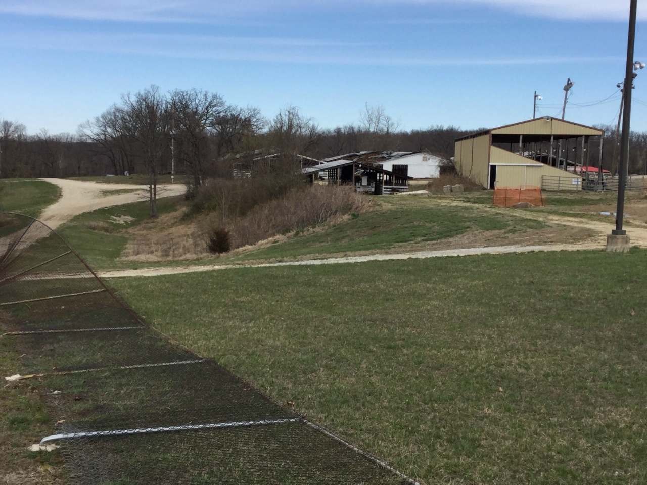 Photo of fence blown over at Jefferson County Fairgrounds.