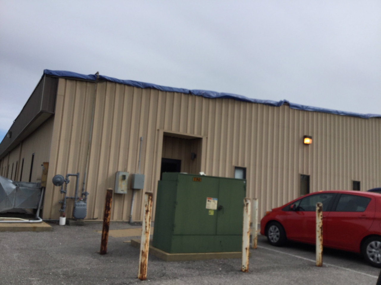 Photo of minor roof damage to business building.