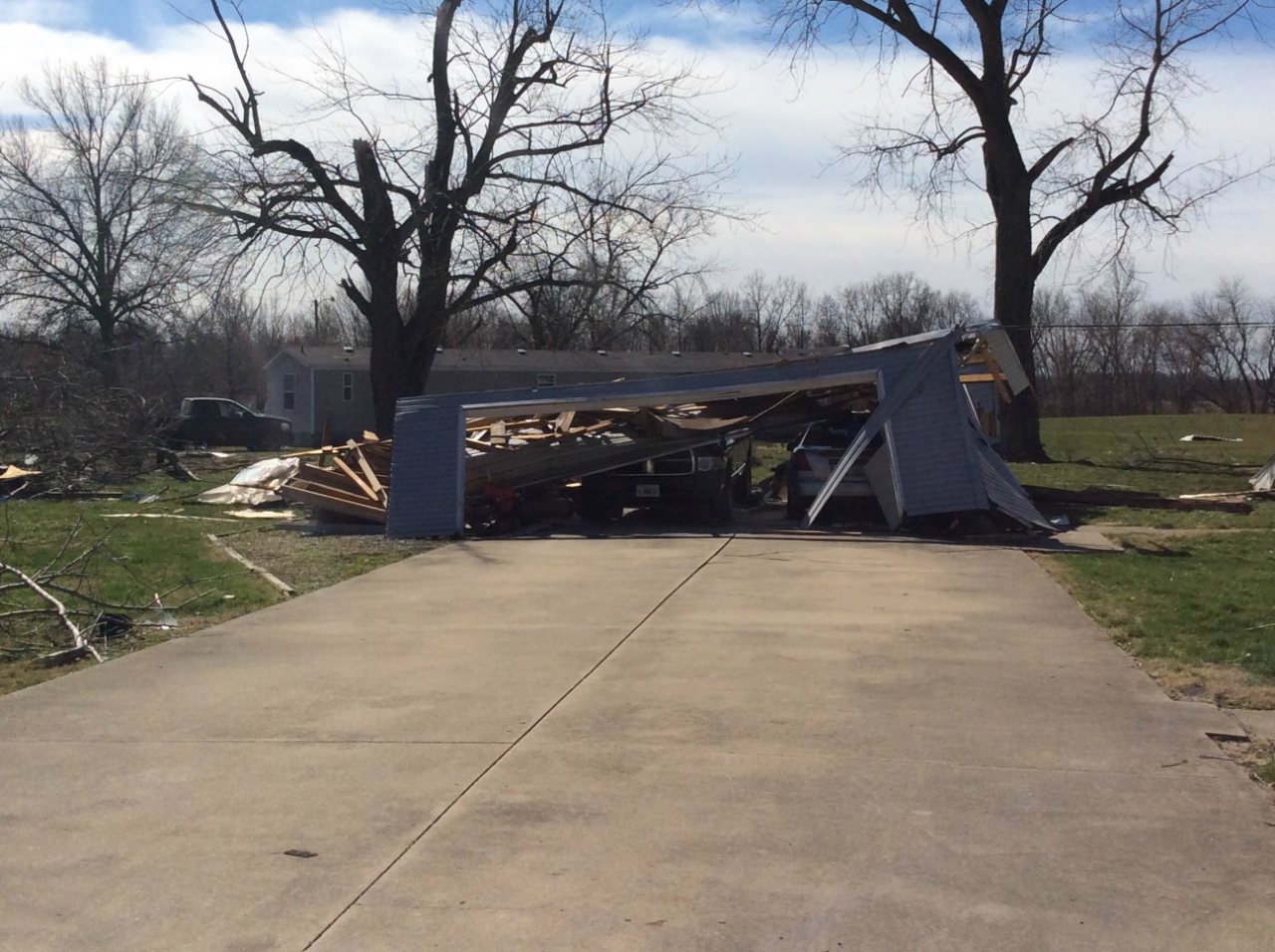 Photo of destroyed garage and vehicles on Stewart Street.