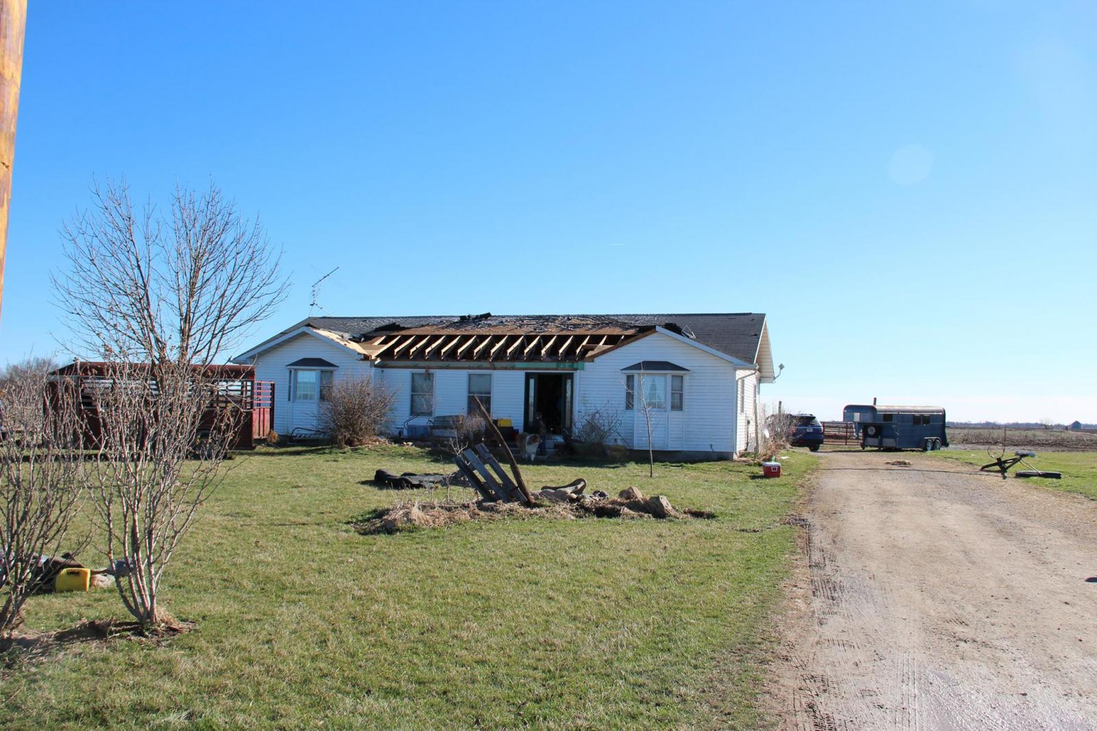 Photo of roof damage to a house on County Road 419, just north of U.S. Hwy 36.
