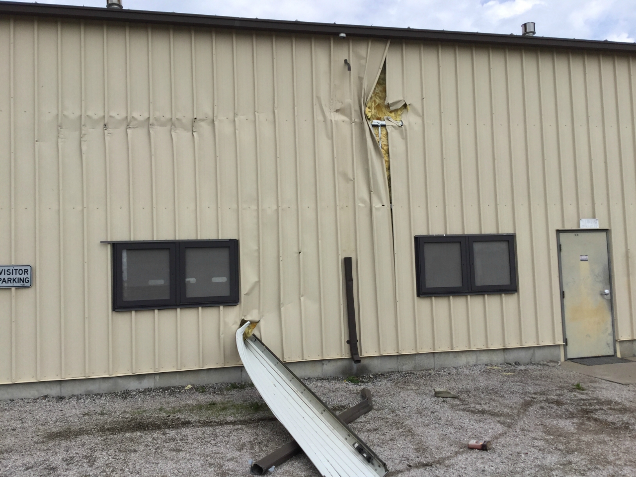Photo of minor damage to MODOT outbuilding.