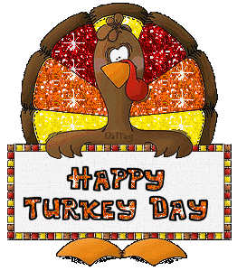 Gif image of a turkey holding a sign that says Happy Turkey Day.