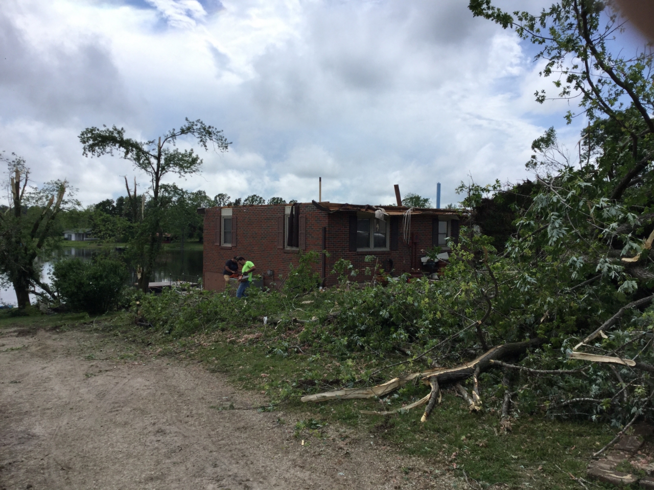 Photo of roof damage from tornadic winds estimated around 130 mph.