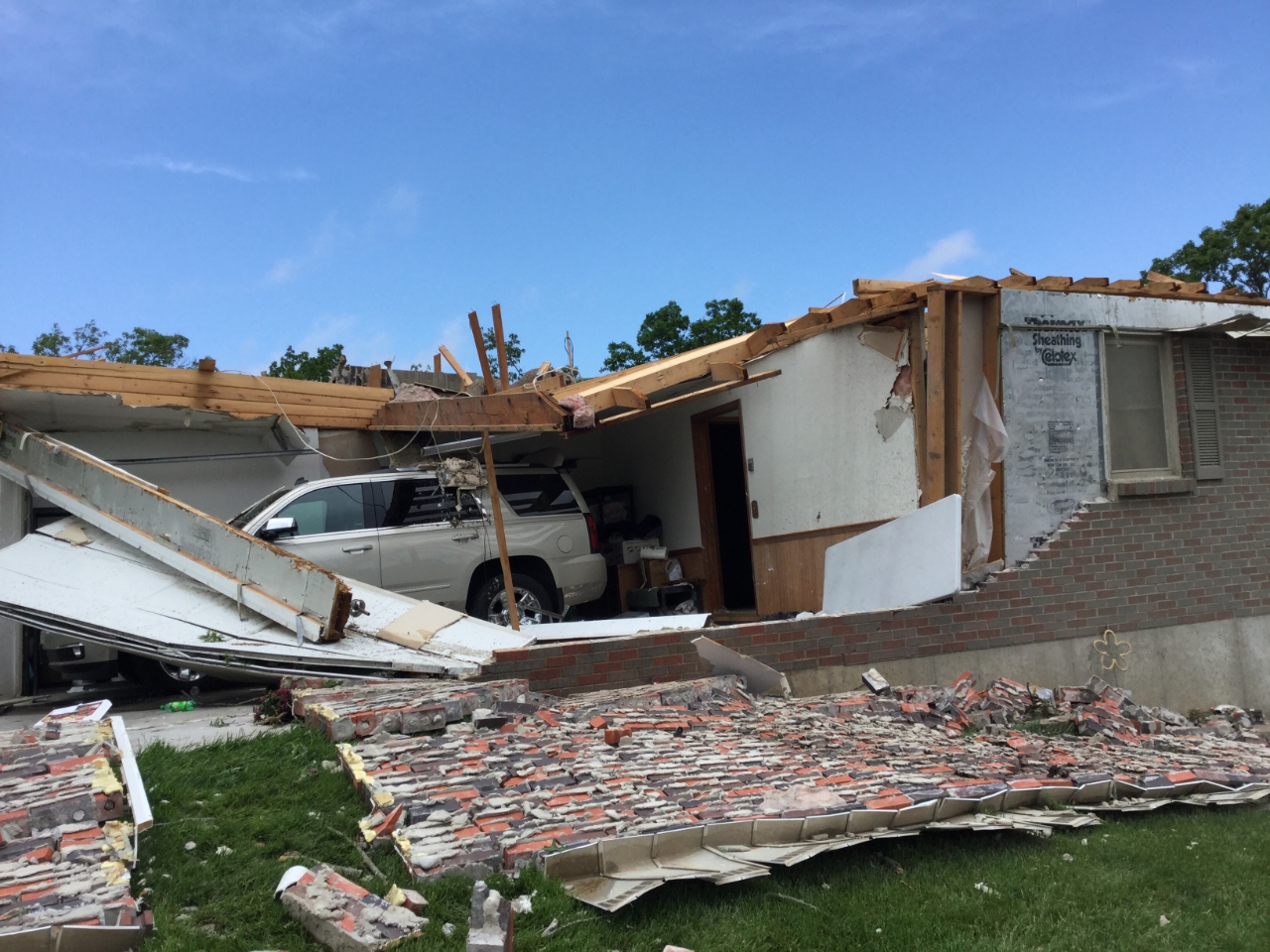 Large section of a house's roof removed by 130 mph tornadic winds.