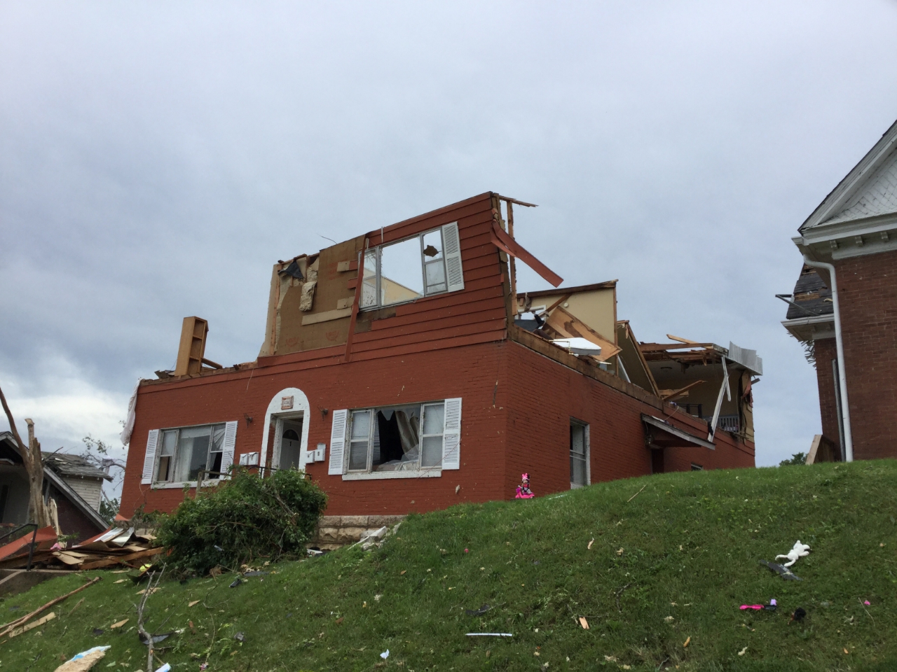 Photo of a two story house where the second story was completely destroyed by 130 mph tornadic winds.