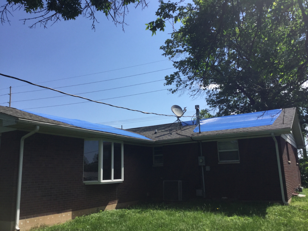 Photo of minor roof damage to a home.