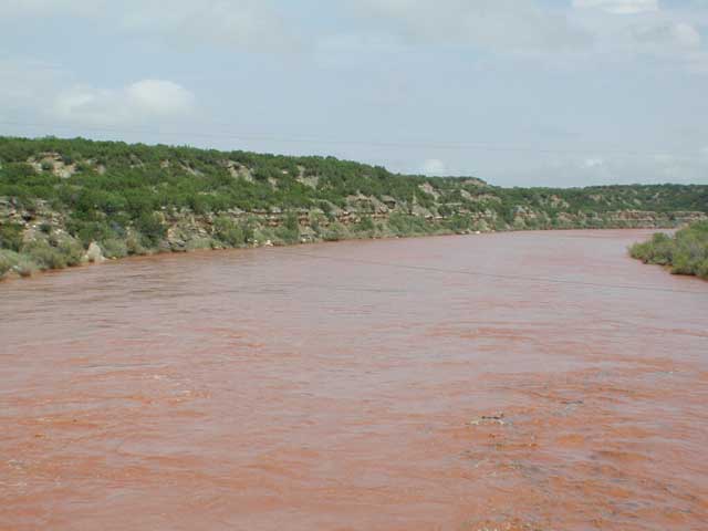 Flood waters flowing down the Salt Fork of the Brazos River east of Jayton and north of AspermontÂ on Wednesday afternoon (July 28, 2004).