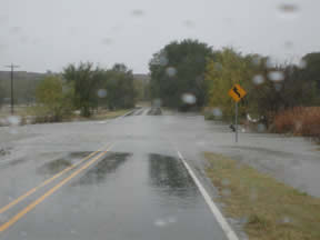 Water running over the road and into Buffalo Springs Lake on 11/17/2004