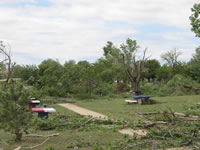 Damage associated with the tornado in the Fair Park area (east of the High School).